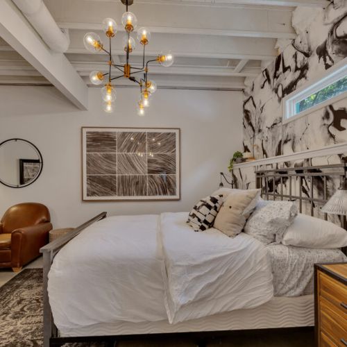 modern metal frame create a dramatic, chic sleep space.