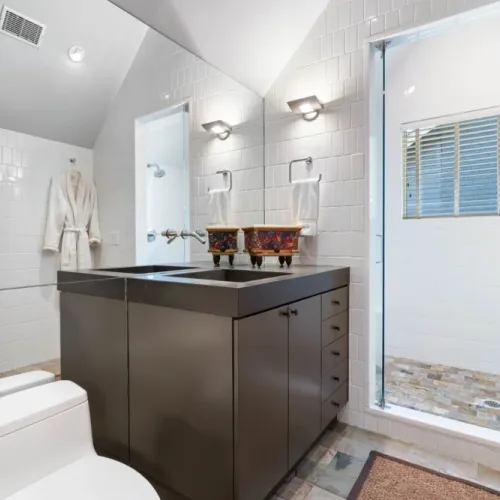 Ensuite bathroom w/ glass shower & direct access from the bedroom