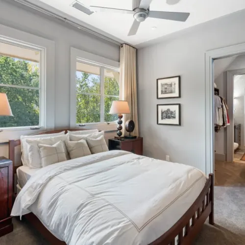 Peaceful bedroom w/ natural light & soft neutral tones