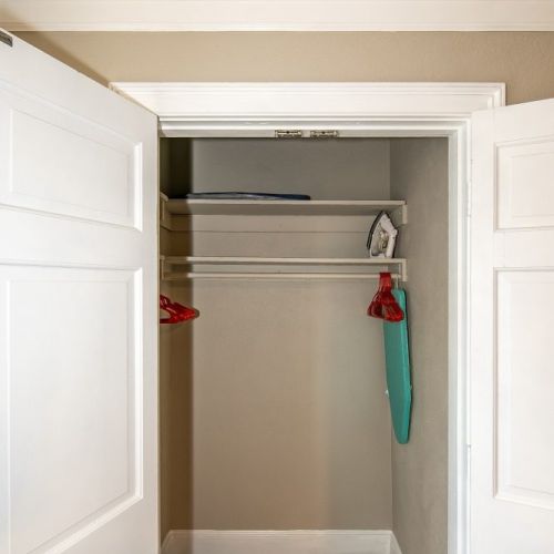 Closet with ironing desk and hangers