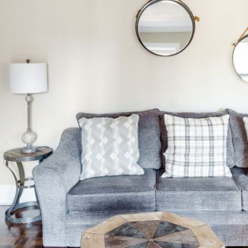 Living area with table lamps and plenty of natural light