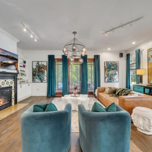 The built-ins and that statement chandelier make this living room unforgettable.