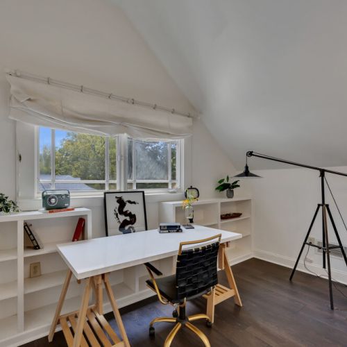 Work from home goals! Love the clean lines and the bold statement lamp in this bright attic office