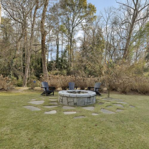 Fire pit area with Adirondack chairs
