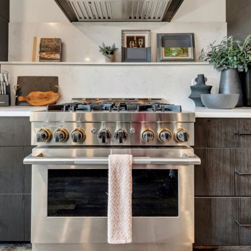 Built-in microwave & wine fridge nook w/ clean cabinetry & counter space