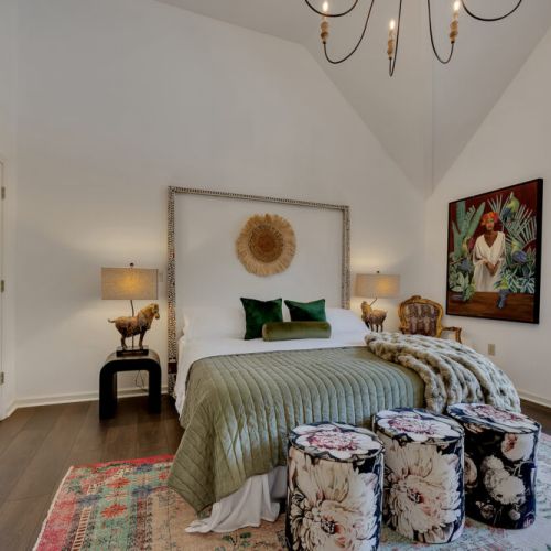 bedroom 2- A cozy and eclectic bedroom featuring rich textures