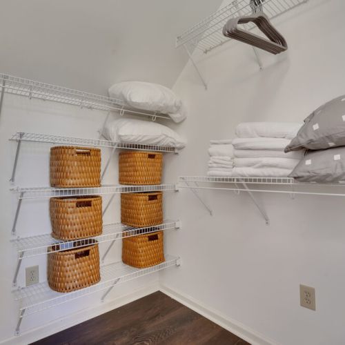 A vase with a bouquet of light pink and white flowers sits on the countertop