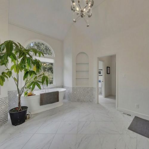 Primary Bedroom - Designer geometric tile and marble-style flooring