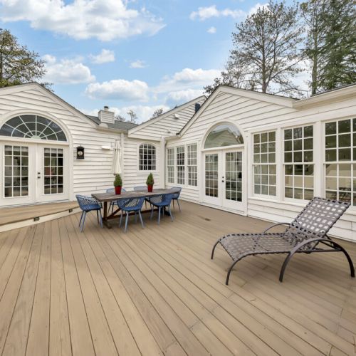Large deck w/ multiple seating areas for relaxing or entertaining