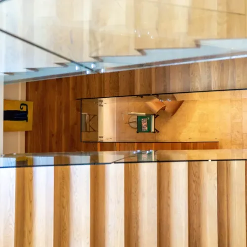 Open stair design offering a unique view down to the lower level