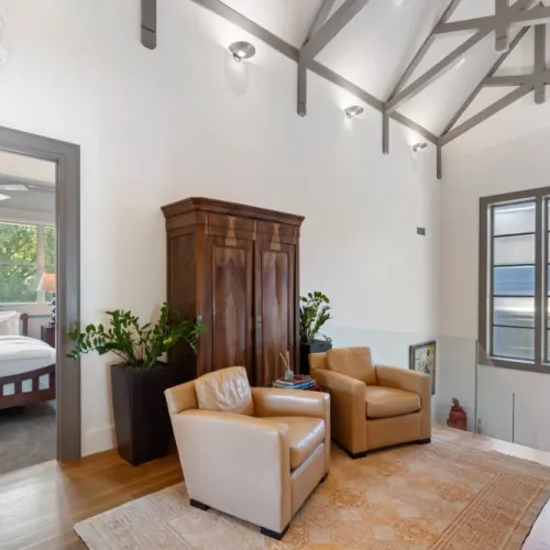 Comfortable leather chairs creating a warm, inviting seating area