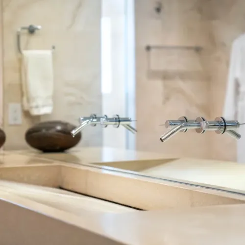 Sleek vanity w/ modern fixtures & clean, minimal design