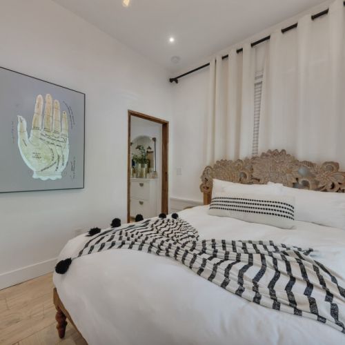 Charming bedroom with palmistry art