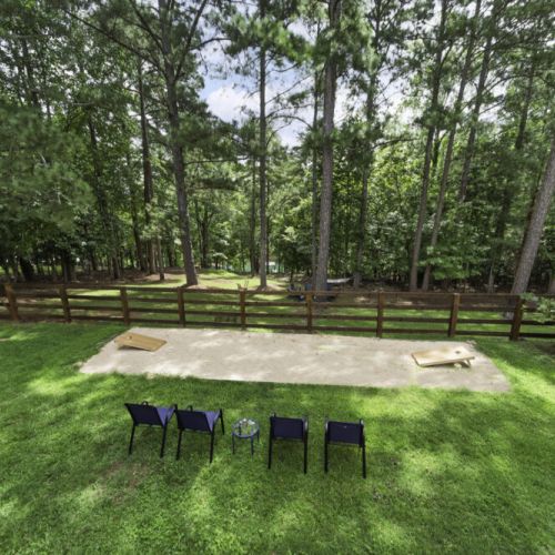 Cornhole court with sand base + chairs