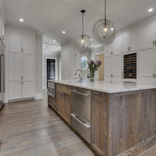 Spacious kitchen w/ dual dishwashers & clean cabinetry for effortless hosting