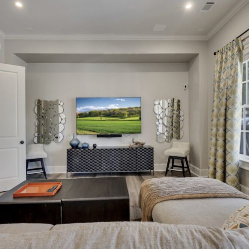 Comfortable bedroom w/ large windows & cozy bedding for restful nights
