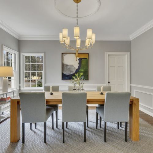 Elegant chandelier elevates the dining room’s classic style