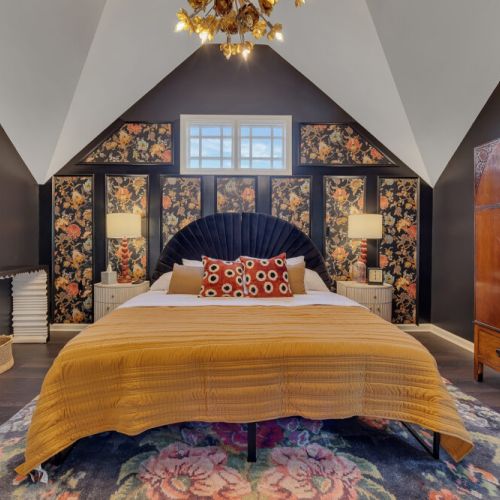 The main walls and ceiling are painted a deep charcoal or black color