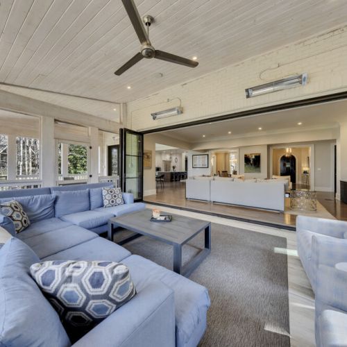 Spacious exterior lounge w/ cozy seating & open-air design for laid-back evenings