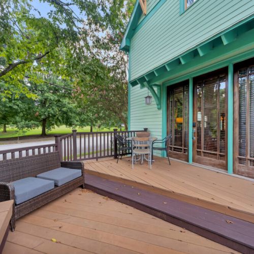 The deck features wood planks with a warm