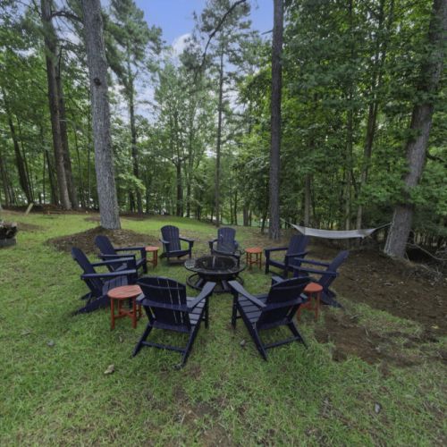 Fire pit area with Adirondack chairs