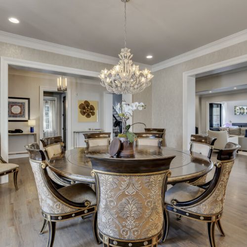 Formal dining area w/ chandelier lighting, perfect for shared meals