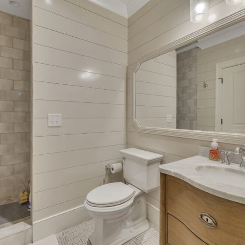 Bathroom 5 - Walk-in tiled shower with stone flooring and spa-like feel.