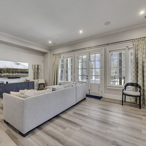 Spacious lower level lounge w/ large seating area for relaxing together