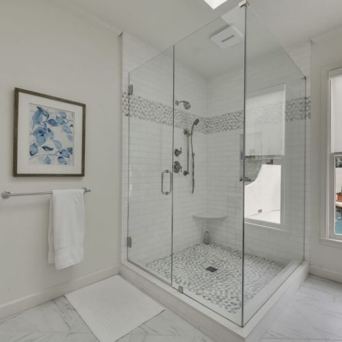 Primary Bedroom - Stylish mosaic tile flooring with slip-resistant design