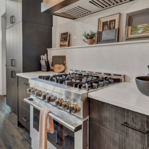 Built-in microwave & wine fridge nook w/ clean cabinetry & counter space