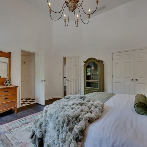 Eclectic style meets comfort in this light-filled bedroom