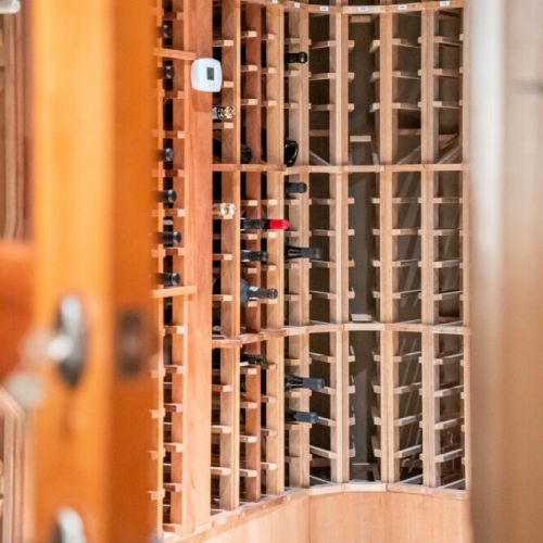 Custom shelving designed to showcase premium wine bottles