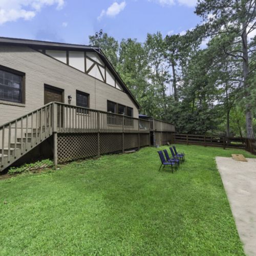 Shaded yard surrounded by mature trees with peaceful nature views