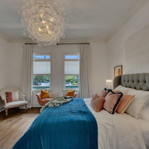 bold pops of color from the abstract art and blue bedding