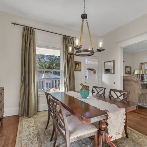 Dinning room - Tall windows dressed with full-length curtains