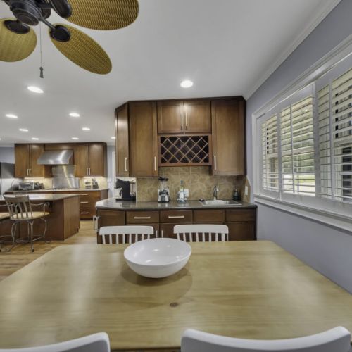 Cozy breakfast table next to large windows