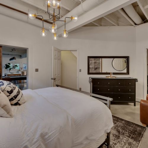 Loving the contrast of the concrete floor and that incredible accent wall.