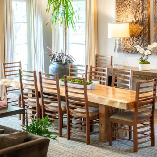 Long dining table w/ seating for a group, perfect for shared meals & gatherings