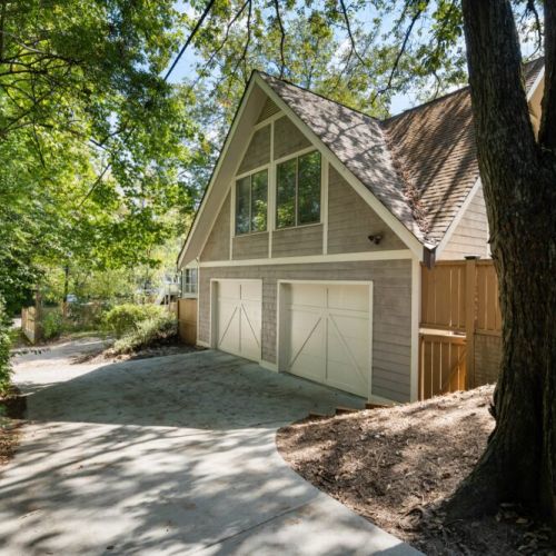 Private driveway leading to a detached 2-car garage