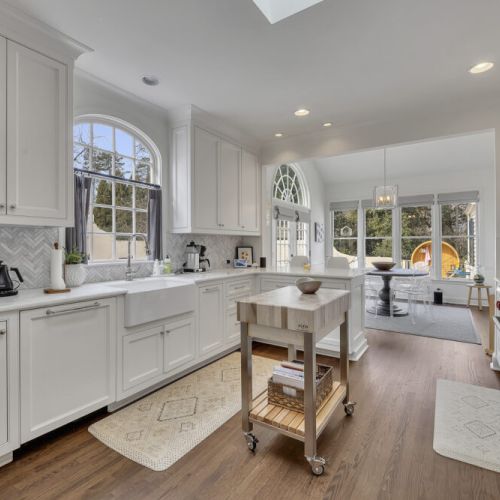 Bright kitchen w/ large island & ample space for prep & cooking