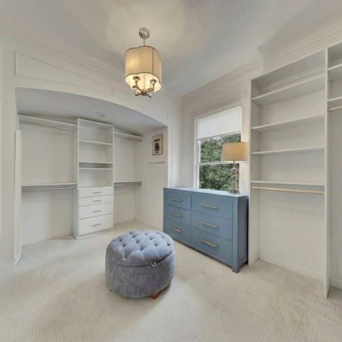 Primary Bedroom - Oversized walk-in closet with custom shelving