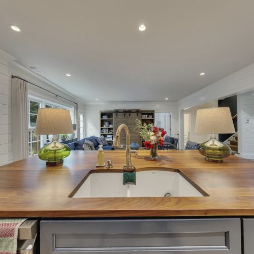 Basement Kitchen 2 - Open-concept flow to kitchen and bar seating.