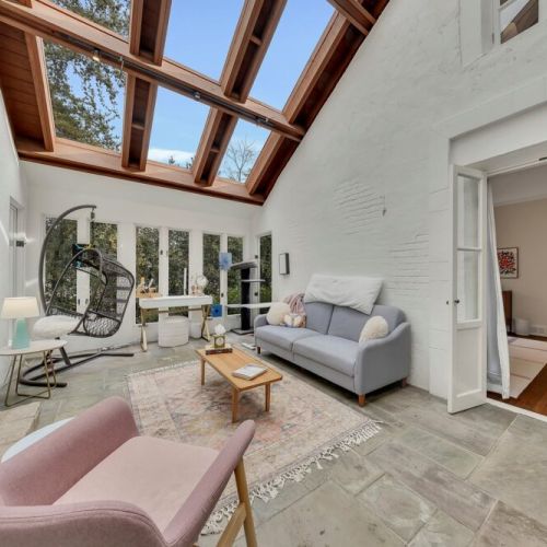 Dramatic skylight ceiling with exposed wood beams