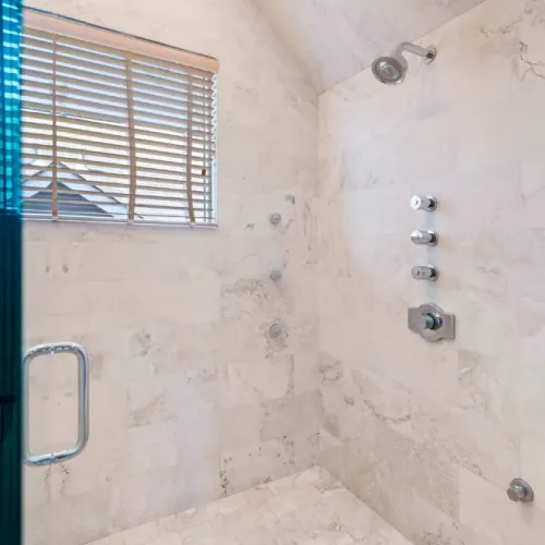 Walk-in shower w/ rainfall head for a refreshing experience