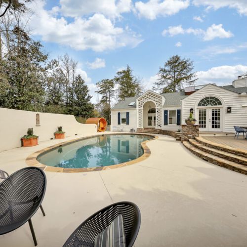Pool flows naturally into deck space for easy indoor-outdoor living