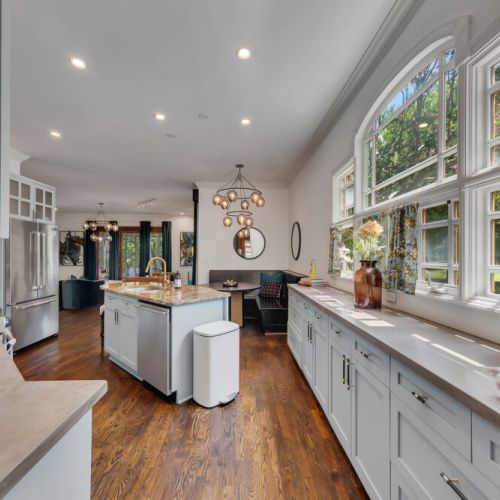 a built-in black banquette, and a striking globe chandelier.