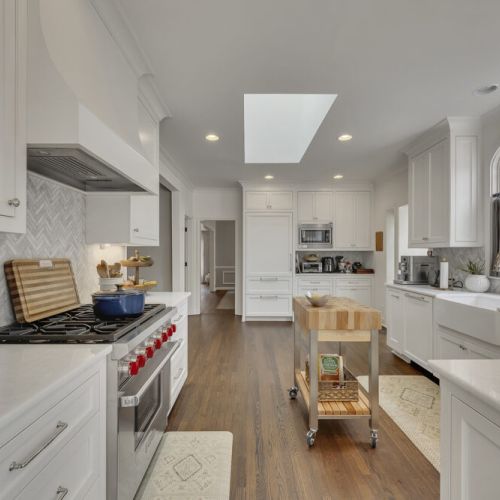 Spacious chef’s kitchen w/ large island & skylight above