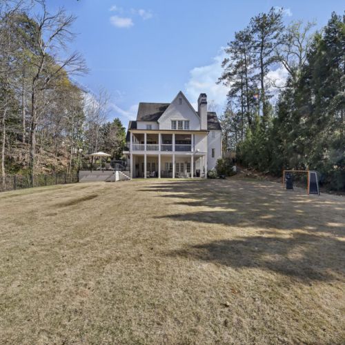 Expansive backyard w/ open lawn, perfect for outdoor play or quiet afternoons