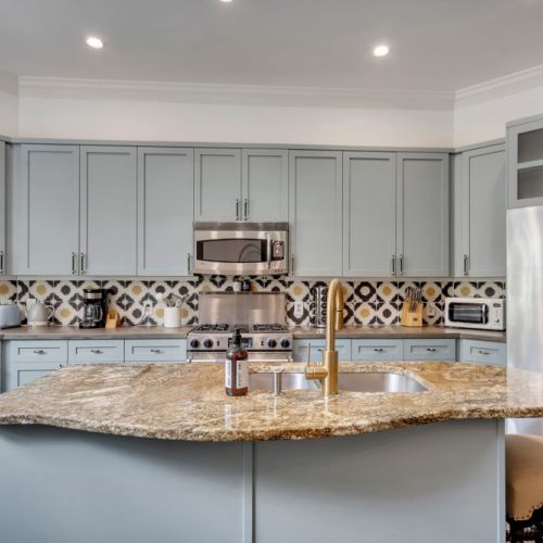 This open-concept space blends modern amenities with cozy seating