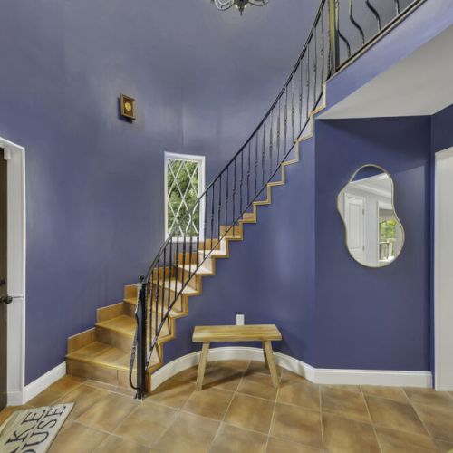 Curved staircase with elegant wrought-iron railing